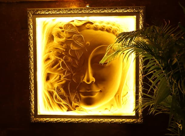 Backlit Buddha sculpture